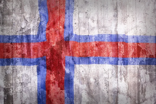 Grunge stil av Färöarna flagga på en tegelvägg — Stockfoto