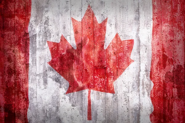 Grunge stil av Kanada flagga på en tegelvägg — Stockfoto