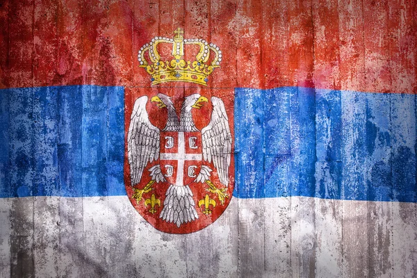 Style grunge flagi Serbii na ceglany mur — Zdjęcie stockowe