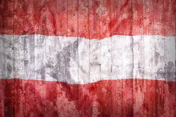 Grunge-Stil der Österreich-Flagge auf einer Ziegelwand — Stockfoto