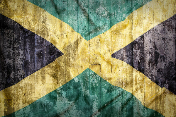 Grunge style of Jamaica flag on a brick wall