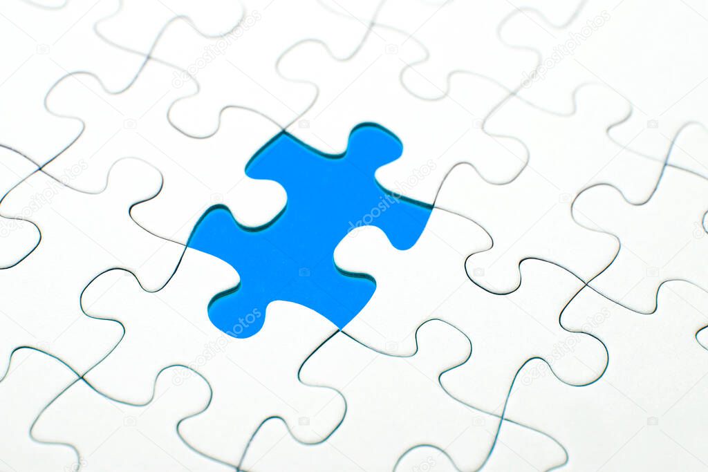 Puzzle piece missing on a blue background