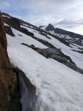 Summit cross at Schonbichler Horn, Berlin high path, Zillertal Alps in Tyrol, Austria