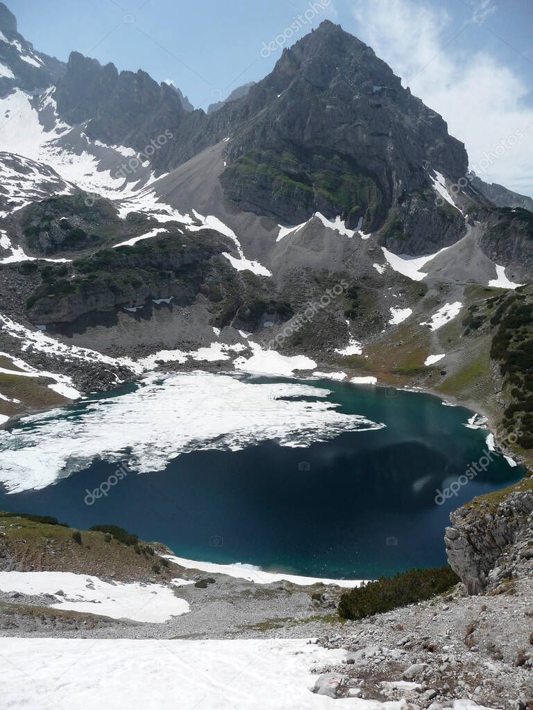 Via ferrata at high mountain lake Seebensee, Zugspitze mountain, Tyrol, Austria in summertime