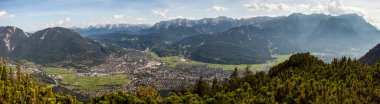 View to Garmisch-Partenkirchen from Kramerspitze mountain, in Bavaria, Germany in summertime clipart