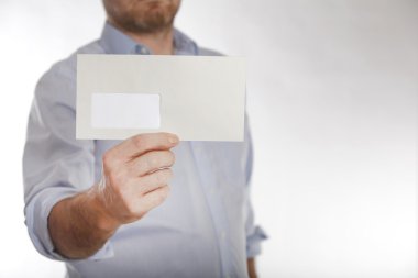 Man holds a letter into the camera clipart