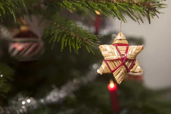 Straw stars on a christmas tree — Stock Photo, Image
