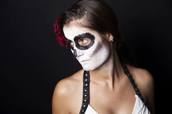 Woman with makeup of la Santa Muerte with red rose — Stock Photo, Image