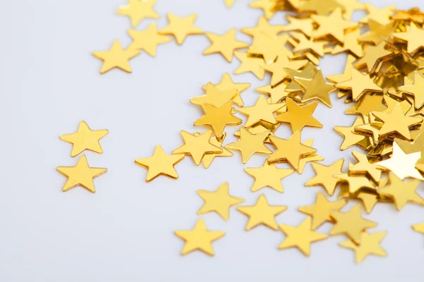 Gouden sterren als een achtergrond voor Kerstmis — Stockfoto