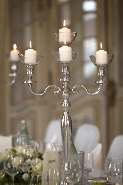 Candles at a laid table — Stock Photo, Image