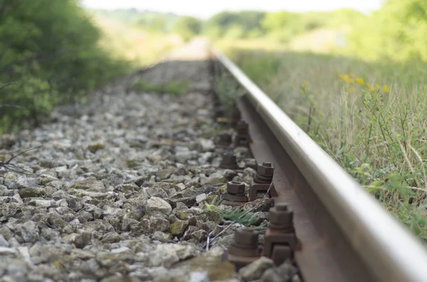 train tracks in the rain of stones