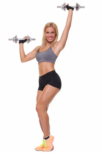 Woman lifting dumbbells — Stock Photo, Image