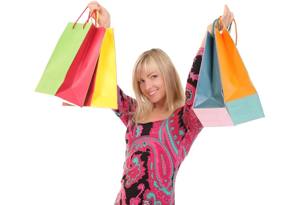 Portrait of young woman with shopping bags against white background Royalty Free Stock Photos