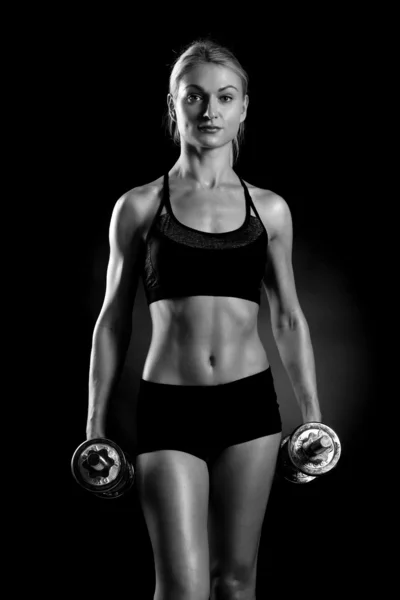 Sexy and fit woman lifting hand weights — Stock Photo, Image