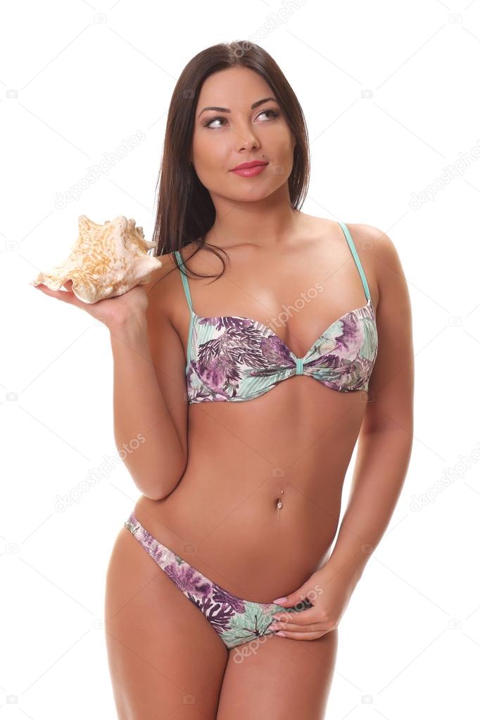 woman in bikini holding shell