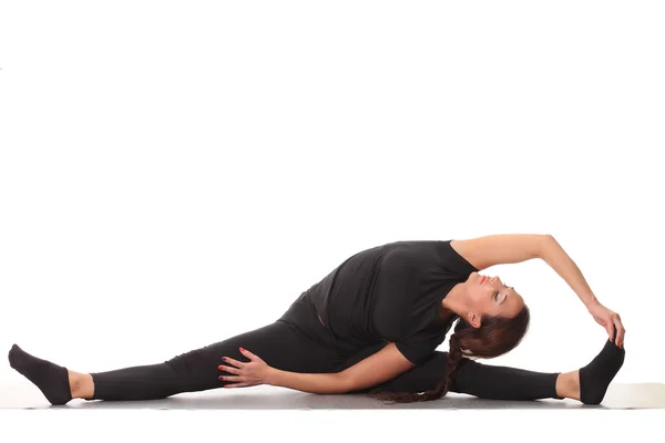 Young flexible girl doing yoga — Stock Photo, Image