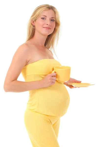 Bir bardak tutan güzel hamile kadın — Stok fotoğraf