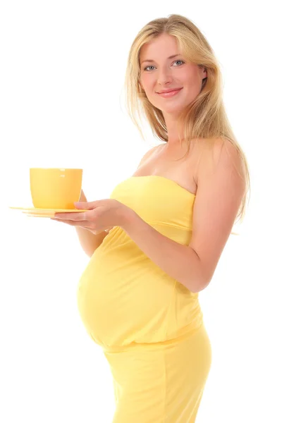 Hermosa mujer embarazada sosteniendo una taza — Foto de Stock