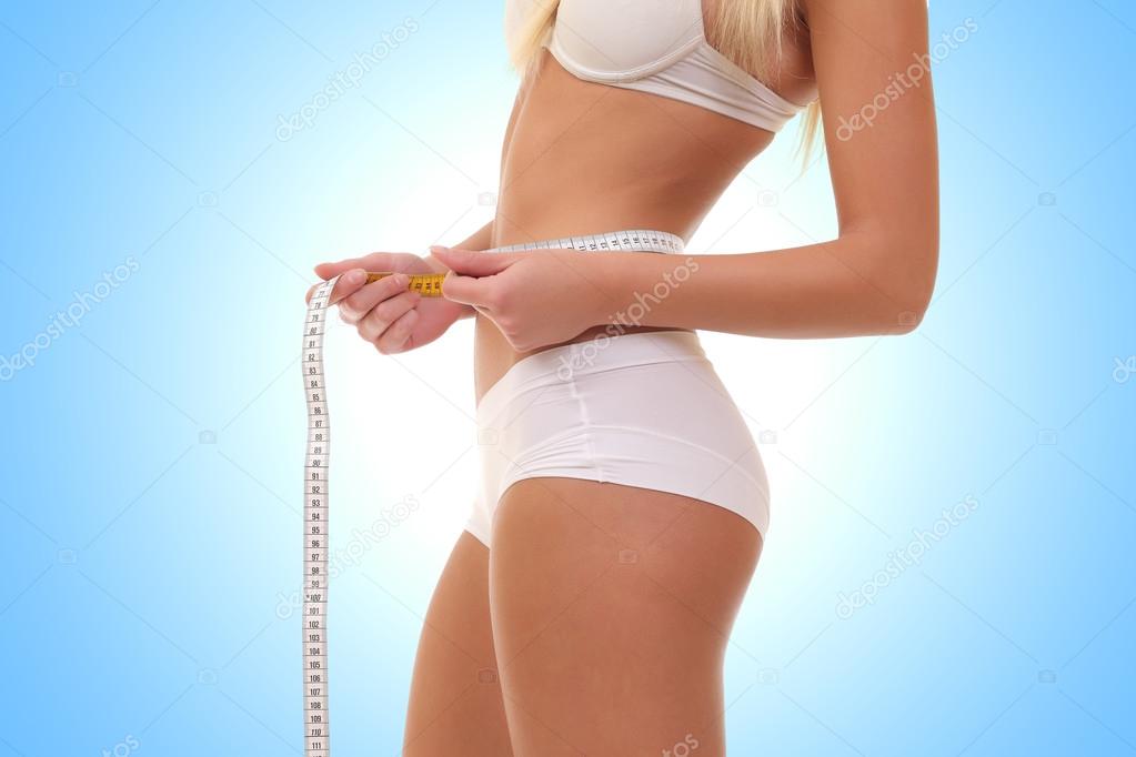 woman with measure tape on a white background