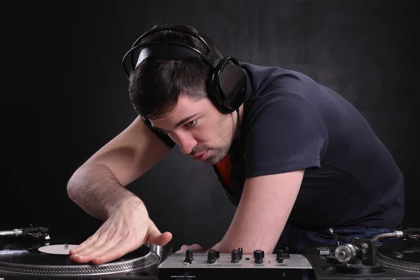 Dj spinning the decks at the nightclub Stock Picture