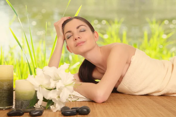 Young girl lying in a spa — Stock Photo, Image
