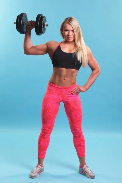 Beautiful sporty  woman working out with dumbbells — Stock Photo, Image