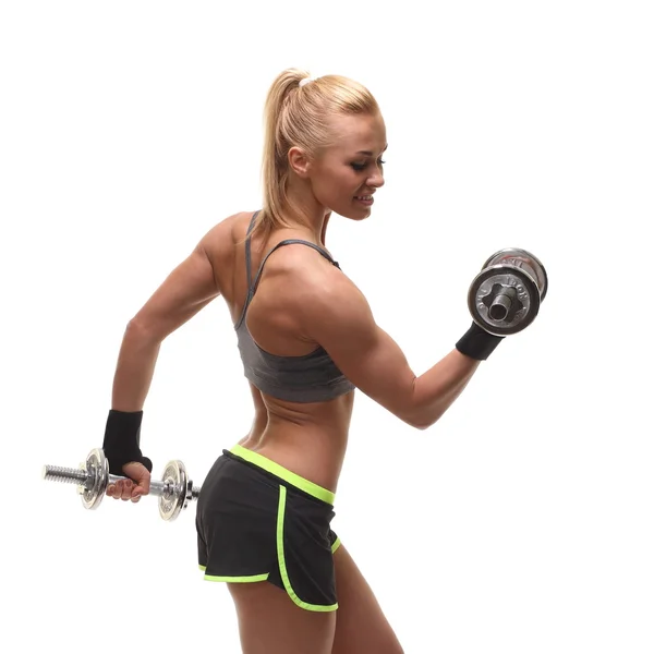 Beautiful sporty  woman working out with dumbbells — Stock Photo, Image