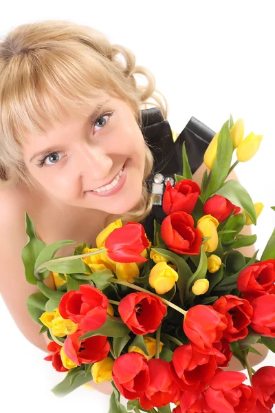 Beautiful girl in the tulips — Stock Photo, Image