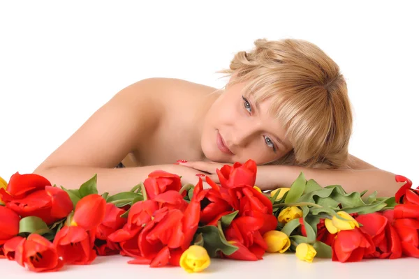 Beautiful girl in the tulips — Stock Photo, Image