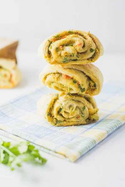 Home made buns with garlic, green parsley and sweet pepper in a napkin white background. — Stock Image Home Made Buns Garlic Green Parsley Sweet Pepper Napkin White Royalty Free Stock Photos