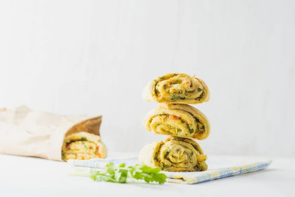 Home made buns with garlic, green parsley and sweet pepper in a napkin white background. — Stock Image Home Made Buns Garlic Green Parsley Sweet Pepper Napkin White Royalty Free Stock Images
