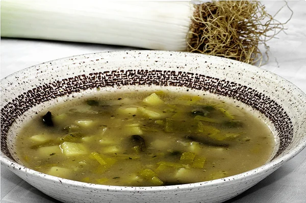 Leek soup with potatoes and peas — Stock Image Leek soup with potatoes and peas Stock Photo