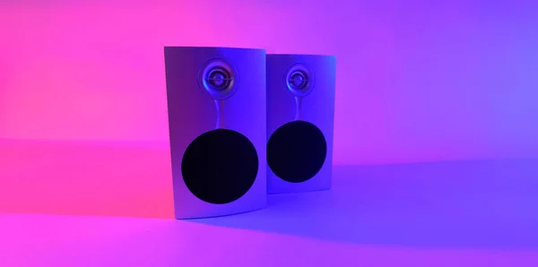 music speakers in neon color photo taken in a photo studio