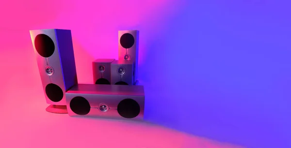 music speakers in neon color photo taken in a photo studio