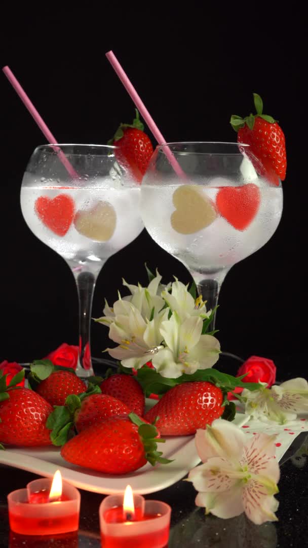 Romantic composition with cocktail glasses on Valentines Day, 4k vertical video — Wideo stockowe