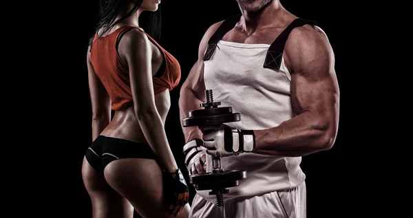 Strong Young Couple Working Out With Dumbbells - Shot In Studio — Stok Foto