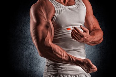 a muscular man with a syringe clipart