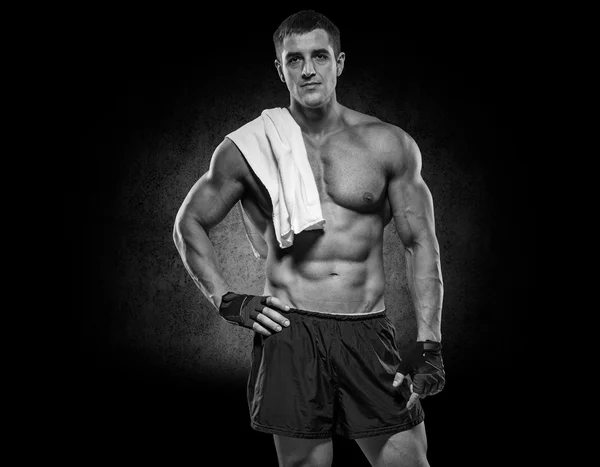 Closeup of a muscular young man lifting weights — Stock Photo, Image