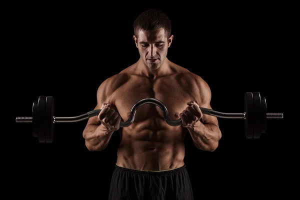 Muscular culturista chico haciendo ejercicios —  Fotos de Stock