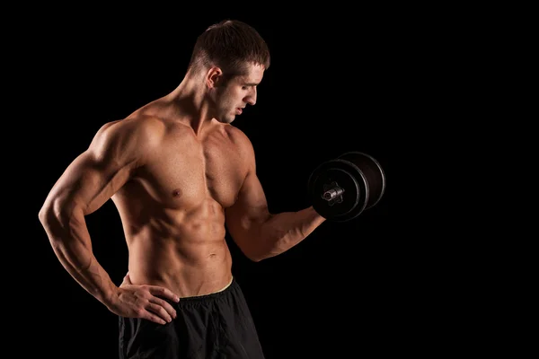 Muscular culturista chico haciendo ejercicios —  Fotos de Stock