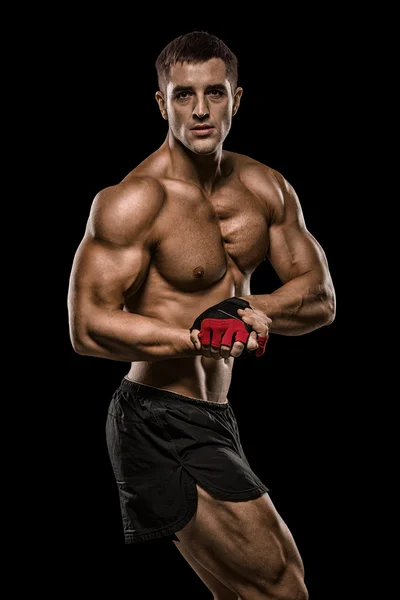 Shirtless bodybuilder holding dumbell and showing his muscular a — Stock Photo, Image