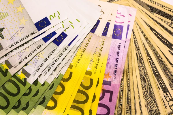 Background from dollar and euro different banknotes — Stock Photo, Image