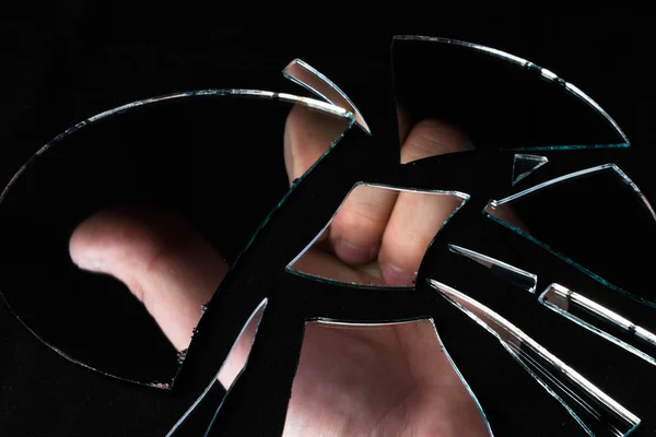 Reflection of the man's hand in broken mirror — Stock Photo, Image