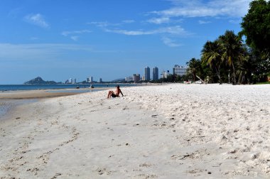 Summer beach vacation concept,  man relaxing on beach, ocean sunny view