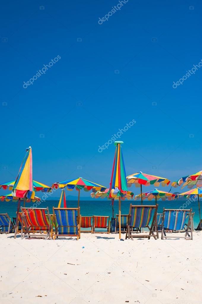 Camp Bed under the umbrella of colorful  on beach Phuket, Thailand.