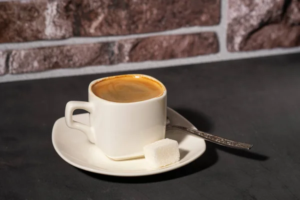 A cup of morning coffee on a dark background selective focus — Stock Photo, Image