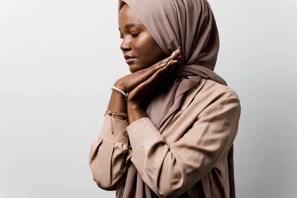 Black woman pray in god. Religious girl on white background. Islamic religion