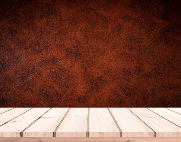 empty wooden table on a background of a wall