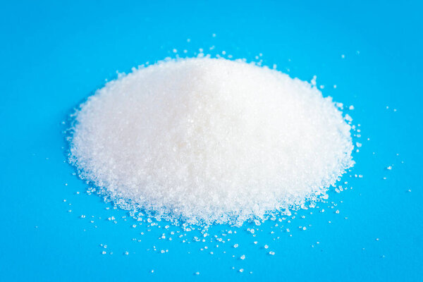 sugar on a blue background. top view.