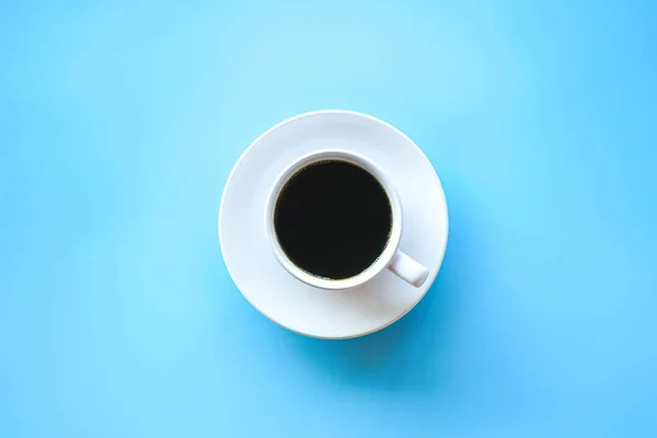 cup of coffee on blue background